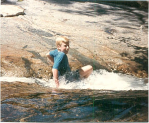 John in Northern Calfornia, playing in glacier fed stream, summer 1989